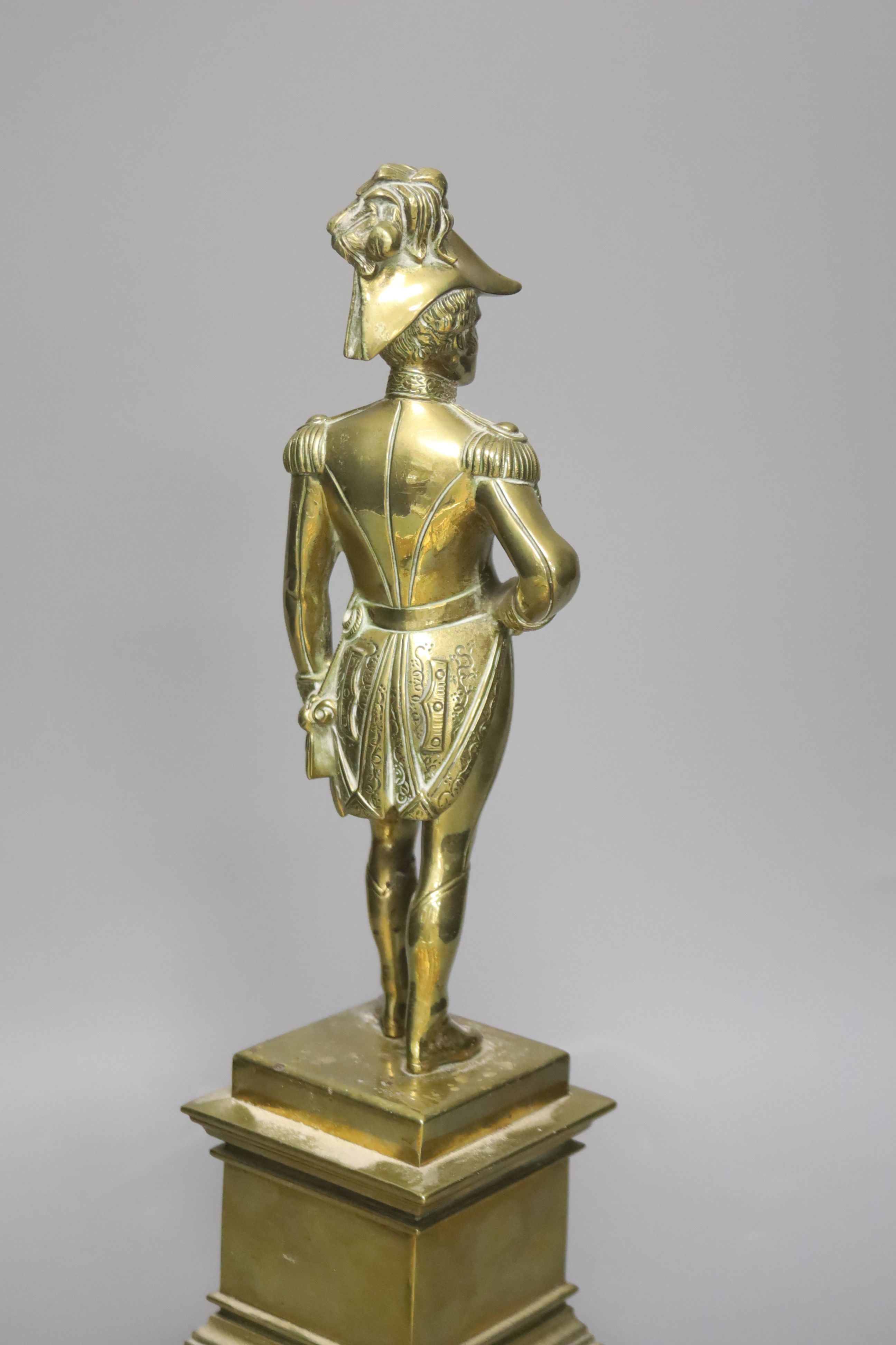 A 19th century brass figure of the Duke of Wellington and various gilt metal finger plates, height 36cm